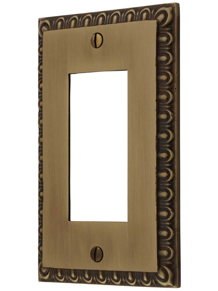 Ovolo Single GFI Cover Plate in Antique Brass.